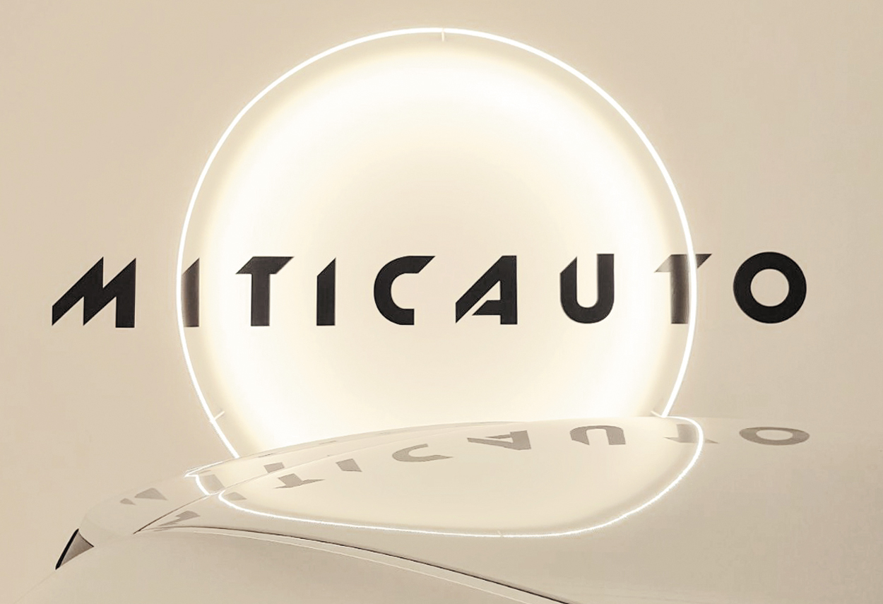 Showroom Miticauto logo and lamp - retail lighting design