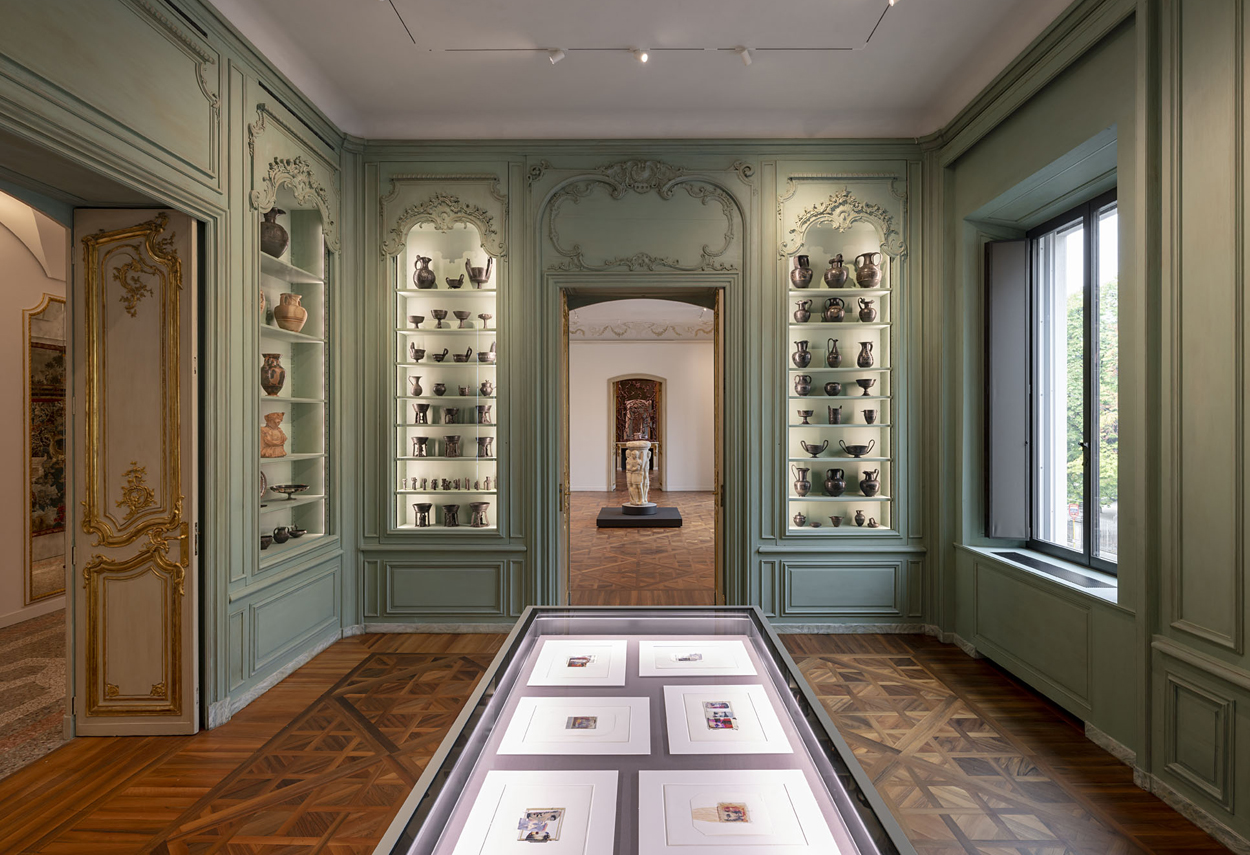 View of the paths and exhibition rooms with lighting that highlights the works