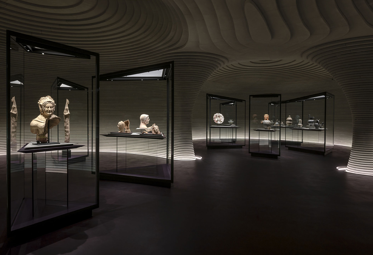 View of the exhibition rooms with illuminated display cases