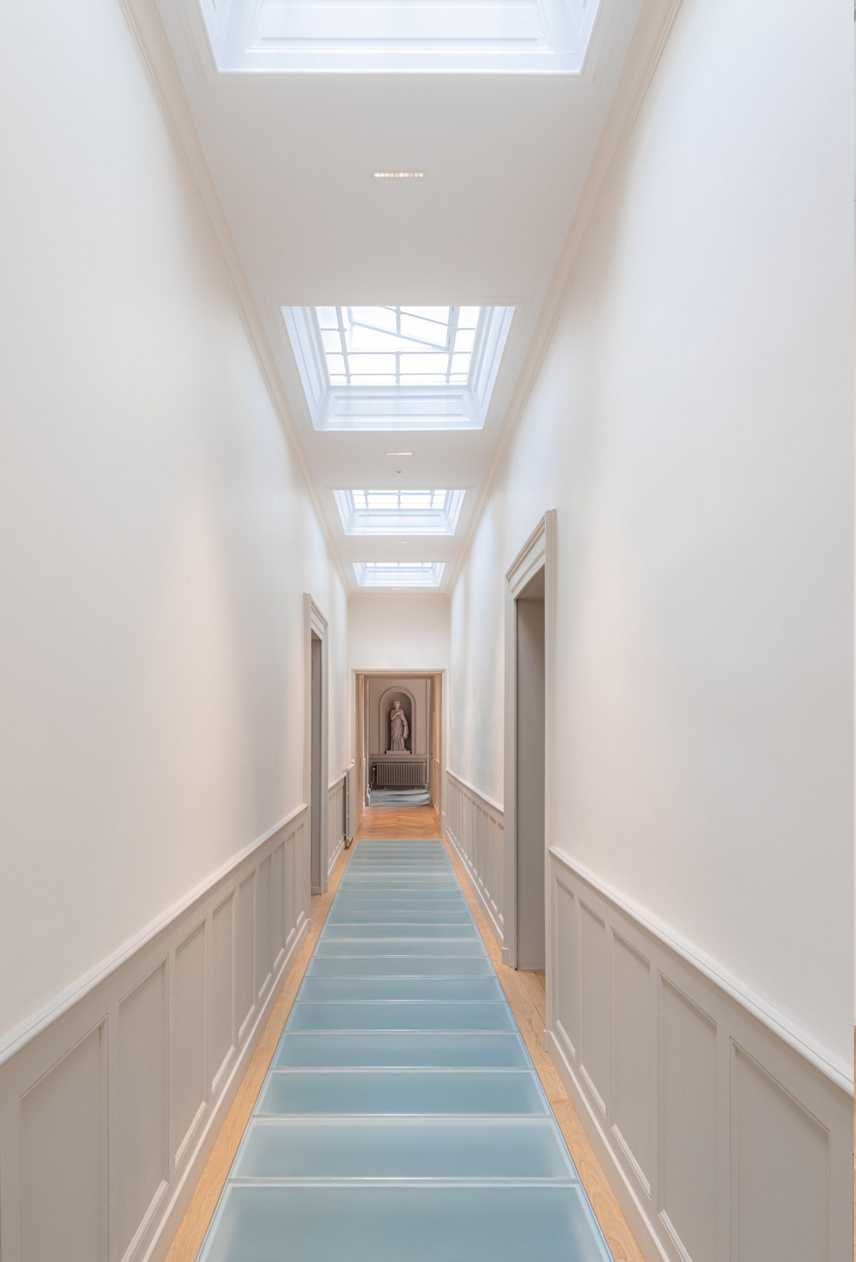 Detail of the corridor with natural ceiling lighting