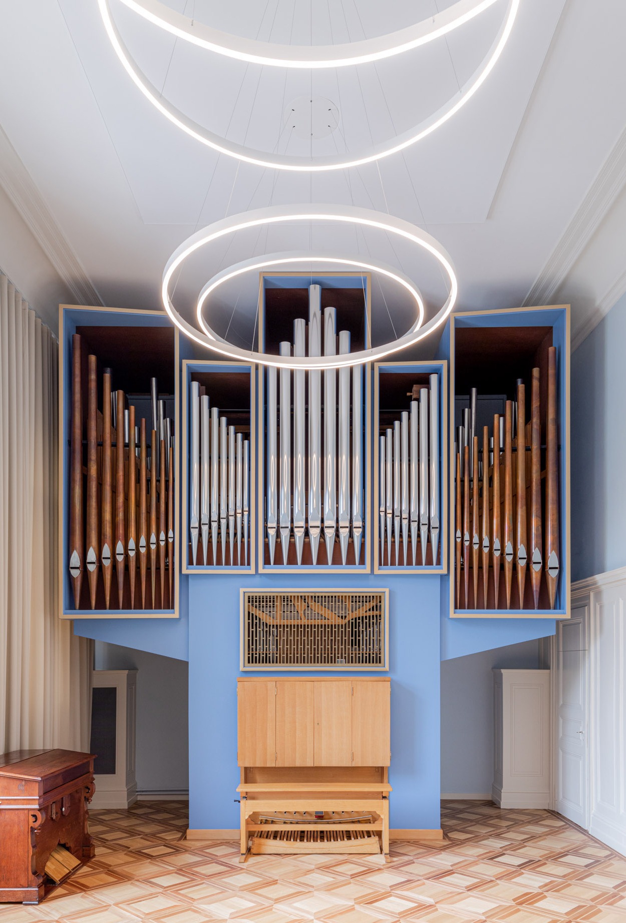 The organ in the conservatory room and the ceiling light fixture