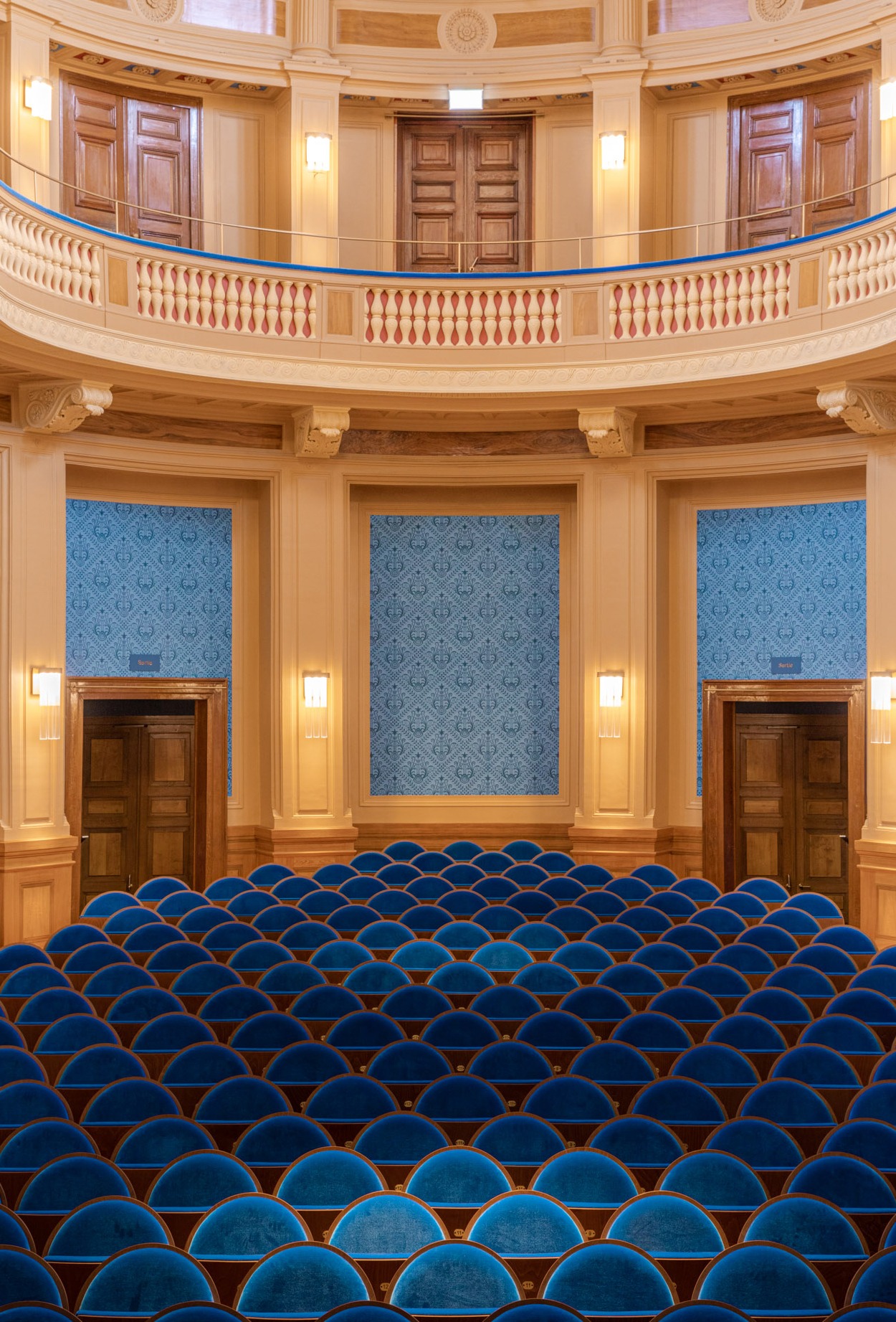 The internal room of the conservatory illuminated with a detail of the seats